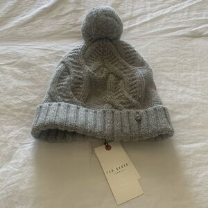TED BAKER LONDON CARRII KNIT 
BOBBLE HAT- color gray size OS 
cable knit Pattern